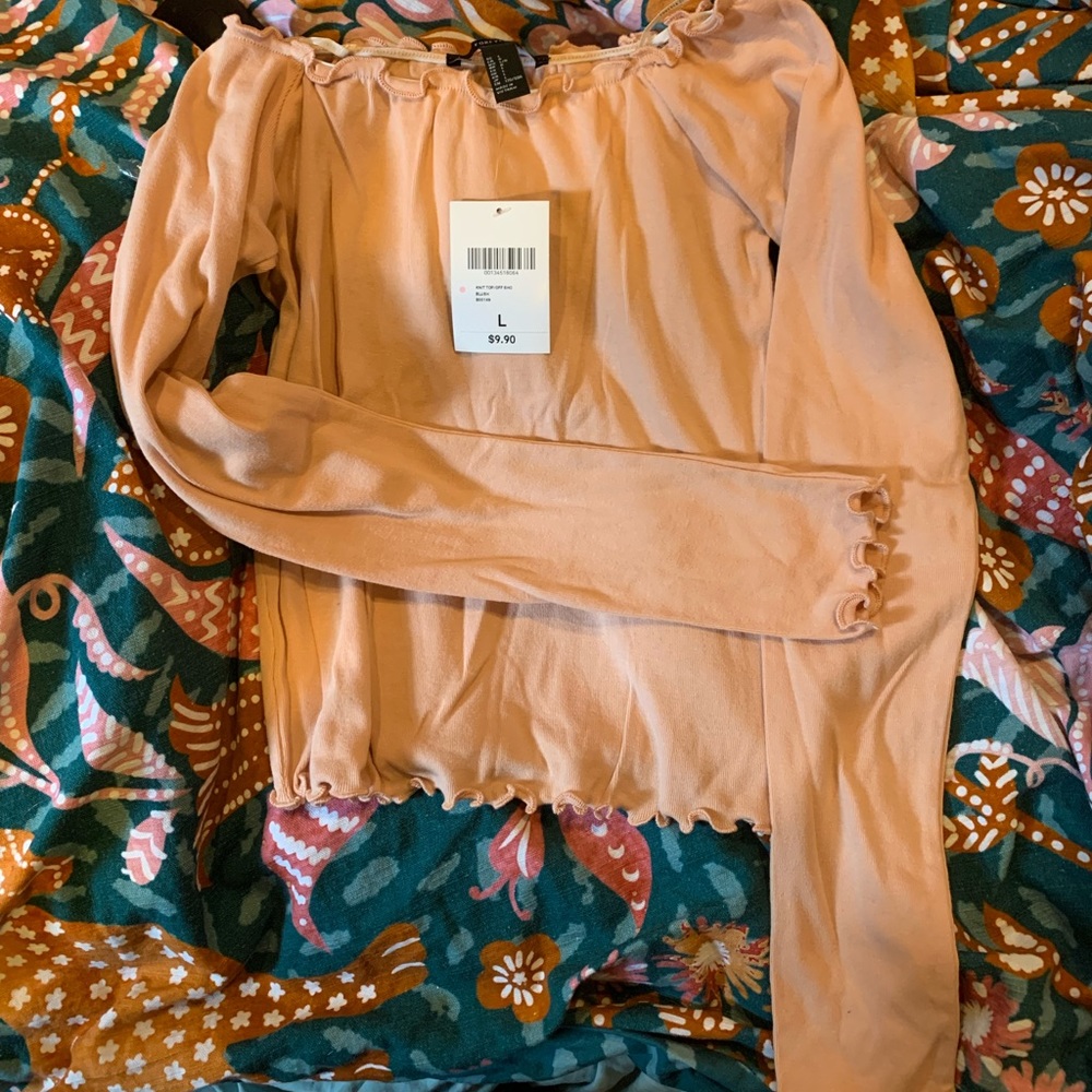 Cute, blush pink ruffled shirts